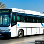 Home 22 오만의 대중교통 이용법 - A modern public bus in Muscat, Oman, featuring a sleek design with large windows and air conditionin...