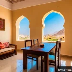 Home 23 오만 여행 비용 절약 팁 - A cozy, sunlit apartment kitchen in Oman with a modern air conditioner visible on the wall, featurin...